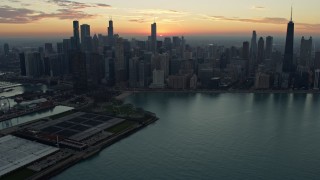 4K aerial stock footage of approaching the city skyline at sunset, Downtown Chicago, Illinois Aerial Stock Footage | AX0163_0035