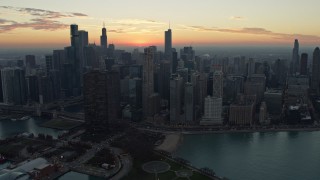 4K aerial stock footage of approaching the skyline at sunset, Downtown Chicago, Illinois Aerial Stock Footage | AX0163_0036