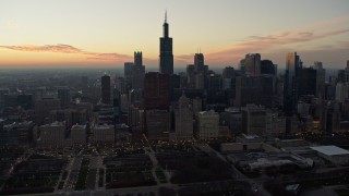 4K aerial stock footage Willis Tower and skyscrapers seen from Grant Park at twilight, Downtown Chicago, Illinois Aerial Stock Footage | AX0163_0049