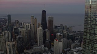 4K aerial stock footage fly past Trump Tower to reveal John Hancock Center at twilight in Downtown Chicago, Illinois Aerial Stock Footage | AX0163_0052