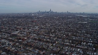 4K aerial stock footage of flying over West Side suburban neighborhoods toward Downtown Chicago, Illinois skyline Aerial Stock Footage | AX0165_0015