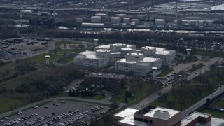 AX0165_0016 - 4K aerial stock footage of orbiting the Cook County Jail in West Side Chicago, Illinois skyline