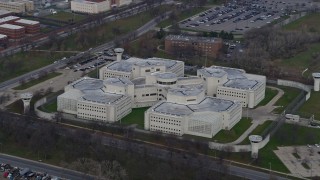 AX0165_0019 - 4K aerial stock footage of the Cook County Jail in West Side Chicago, Illinois skyline