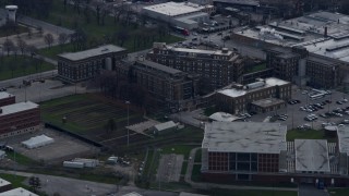 4K aerial stock footage of a reverse view of buildings at the Cook County Jail complex in West Side Chicago, Illinois skyline Aerial Stock Footage | AX0165_0022