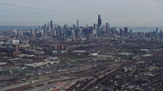 4K aerial stock footage of approaching the Downtown Chicago, Illinois skyline from the West Side Aerial Stock Footage | AX0165_0023