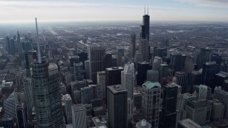 4K aerial stock footage of flying over the city's skyscrapers, toward Willis Tower in Downtown Chicago, Illinois Aerial Stock Footage | AX0165_0058