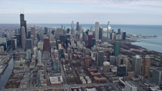 4K aerial stock footage of a reverse view of the city's skyscrapers in Downtown Chicago, Illinois Aerial Stock Footage | AX0165_0060