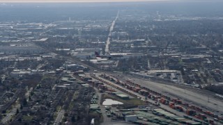 4K aerial stock footage of tracking a commercial jet descending for a landing, Northwest  Side Chicago, Illinois Aerial Stock Footage | AX0166_0018