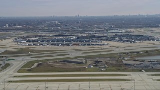 4K aerial stock footage of a reverse view of control tower and terminals at O'Hare International Airport, Chicago, Illinois Aerial Stock Footage | AX0166_0022