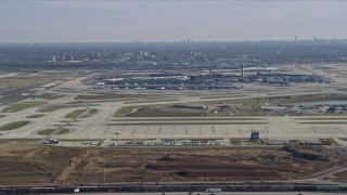 4K aerial stock footage of flying away from O'Hare International Airport, Chicago, Illinois Aerial Stock Footage | AX0166_0023