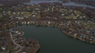 4K aerial stock footage of flying over upscale homes between lakes in Mundelein, Illinois Aerial Stock Footage | AX0166_0035