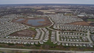 4K aerial stock footage of flying over tract homes in Mundelein, Illinois Aerial Stock Footage | AX0166_0036