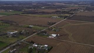 4K aerial stock footage of passing farms around a country road in Union Grove, Wisconsin Aerial Stock Footage | AX0166_0051