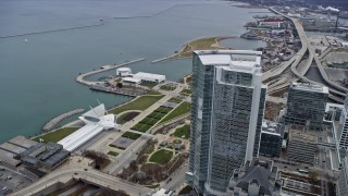 4K aerial stock footage of flying by skyscraper and lakefront museums in Milwaukee, Wisconsin Aerial Stock Footage | AX0166_0076