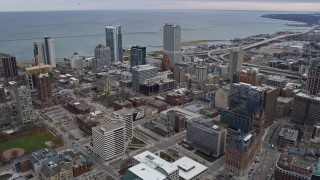 4K aerial stock footage a reverse view of skyscrapers and office buildings in downtown, Milwaukee, Wisconsin Aerial Stock Footage | AX0167_0017