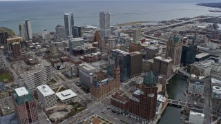 4K aerial stock footage of skyscrapers and office buildings seen from the river in downtown, Milwaukee, Wisconsin Aerial Stock Footage | AX0167_0025