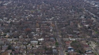 4K aerial stock footage of flying past suburban residential neighborhoods in Skokie, Illinois Aerial Stock Footage | AX0167_0072