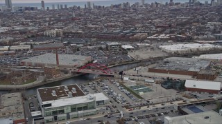 4K aerial stock footage of flying by the Damen Avenue Bridge in North Side Chicago skyline, Illinois Aerial Stock Footage | AX0167_0081