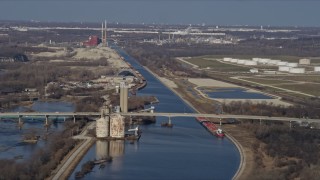 4K aerial stock footage of a bridge spanning a shipping canal in Lockport, Illinois Aerial Stock Footage | AX0168_0032