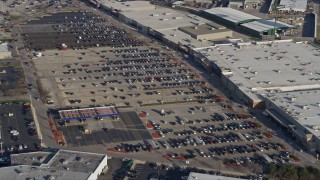 4K aerial stock footage of flying over a parking lot and approach shopping mall, Hodgkins, Illinois Aerial Stock Footage | AX0169_0012