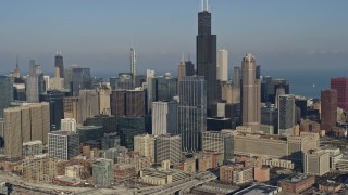 4K aerial stock footage of approaching and flying by Willis Tower and Downtown Chicago skyscrapers, Illinois Aerial Stock Footage | AX0169_0023