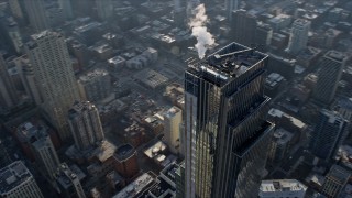 4K aerial stock footage of flying around the top of the One Chicago skyscraper, Downtown Chicago, Illinois Aerial Stock Footage | AX0169_0067