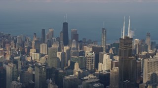 4K aerial stock footage passing tall skyscrapers and city buildings in the downtown area of the city, Downtown Chicago, Illinois Aerial Stock Footage | AX0169_0095