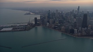 AX0170_0042 - 4K aerial stock footage of panning from Navy Pier to approach downtown at sunset, Downtown Chicago, Illinois