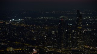 4K aerial stock footage of a baseball stadium lit up at night in West Side Chicago, Illinois Aerial Stock Footage | AX0170_0069