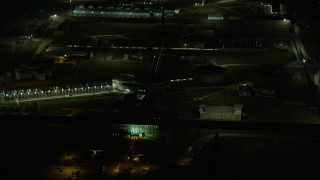 4K aerial stock footage of circling Stateville Correctional Center prison at night, Crest Hill, Illinois Aerial Stock Footage | AX0170_0129