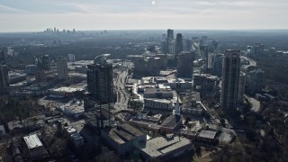 6.7K aerial stock footage flyby Buckhead office buildings and skyscrapers, Atlanta skyline in background, Georgia Aerial Stock Footage | AX0171_0026