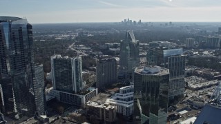 6.7K aerial stock footage of Buckhead office buildings with Atlanta skyline visible in distance, Georgia Aerial Stock Footage | AX0171_0028