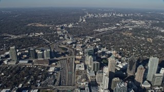 AX0171_0095 - 6.7K aerial stock footage following the freeway by Midtown toward Buckhead in Atlanta, Georgia