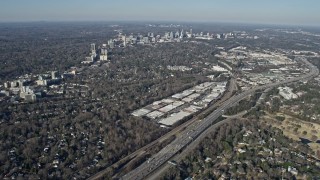 6.7K aerial stock footage tilt from office buildings to reveal Buckhead in the distance, Atlanta, Georgia Aerial Stock Footage | AX0171_0096