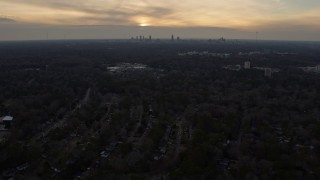 6.7K aerial stock footage tilt from homes in Decatur at sunset, reveal Atlanta skyline, Georgia Aerial Stock Footage | AX0171_0140