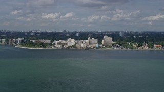 6.7K aerial stock footage of approaching a waterfront hospital in Miami, Florida Aerial Stock Footage | AX0172_003