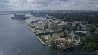 6.7K aerial stock footage of circling a waterfront hospital in Miami, Florida Aerial Stock Footage | AX0172_006