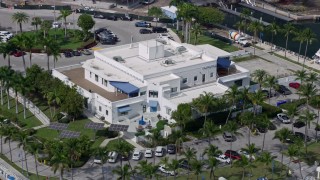 AX0172_010 - 6.7K aerial stock footage of flying past Miami City Hall in Miami, Florida