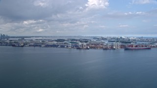 6.7K aerial stock footage of approaching cranes and containers at the Port of Miami, Florida Aerial Stock Footage | AX0172_018