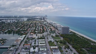 6.7K aerial stock footage fly over beach for view of coastal town of Surfside, Florida Aerial Stock Footage | AX0172_026