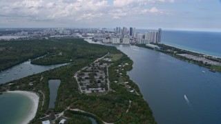 6.7K aerial stock footage flyby FIU Biscayne Bay Campus in North Miami, Florida, approach beachfront condos in Sunny Isles Beach Aerial Stock Footage | AX0172_030