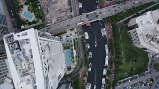 6.7K aerial stock footage a bird's eye of yachts docked on New River in Downtown Fort Lauderdale, Florida Aerial Stock Footage | AX0172_058