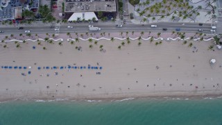 AX0172_063 - 6.7K aerial stock footage of a bird's eye view of sunbathers on the beach in Fort Lauderdale, Florida