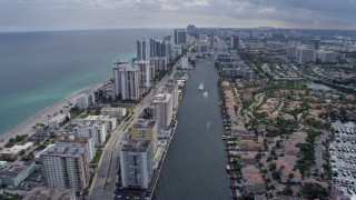 6.7K aerial stock footage tilt from canal to reveal and pass condos in Hollywood, Florida Aerial Stock Footage | AX0172_070