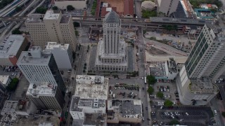 6.7K aerial stock footage approach the Miami-Dade County Courthouse, tilt to bird's eye view in Downtown Miami, Florida Aerial Stock Footage | AX0172_092