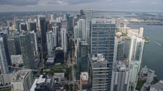 6.7K aerial stock footage orbit Four Seasons Hotel Miami for wider view of skyscrapers in Downtown Miami, Florida Aerial Stock Footage | AX0172_095