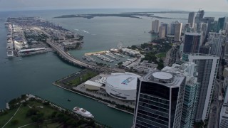 6.7K aerial stock footage orbit arena with view of port, Biscayne Bay, and skyscrapers in Downtown Miami, Florida Aerial Stock Footage | AX0172_098