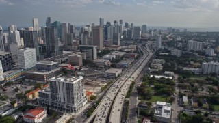 6.7K aerial stock footage of heavy traffic on I-95 and tall skyscrapers in Downtown Miami, Florida Aerial Stock Footage | AX0172_111