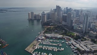 AX0172_117 - 6.7K aerial stock footage of a waterfront park and marina in Downtown Miami, Florida, reveal islands in the bay