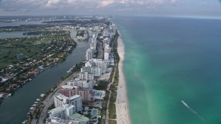 6.7K aerial stock footage tilt from the beach for a wide view of Miami Beach, Florida Aerial Stock Footage | AX0172_137